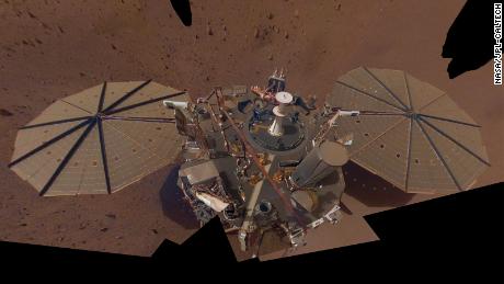                 InSight's second full selfie, made up of multiple images taken in March and April 2019, shows dust accumulating on solar panels.
